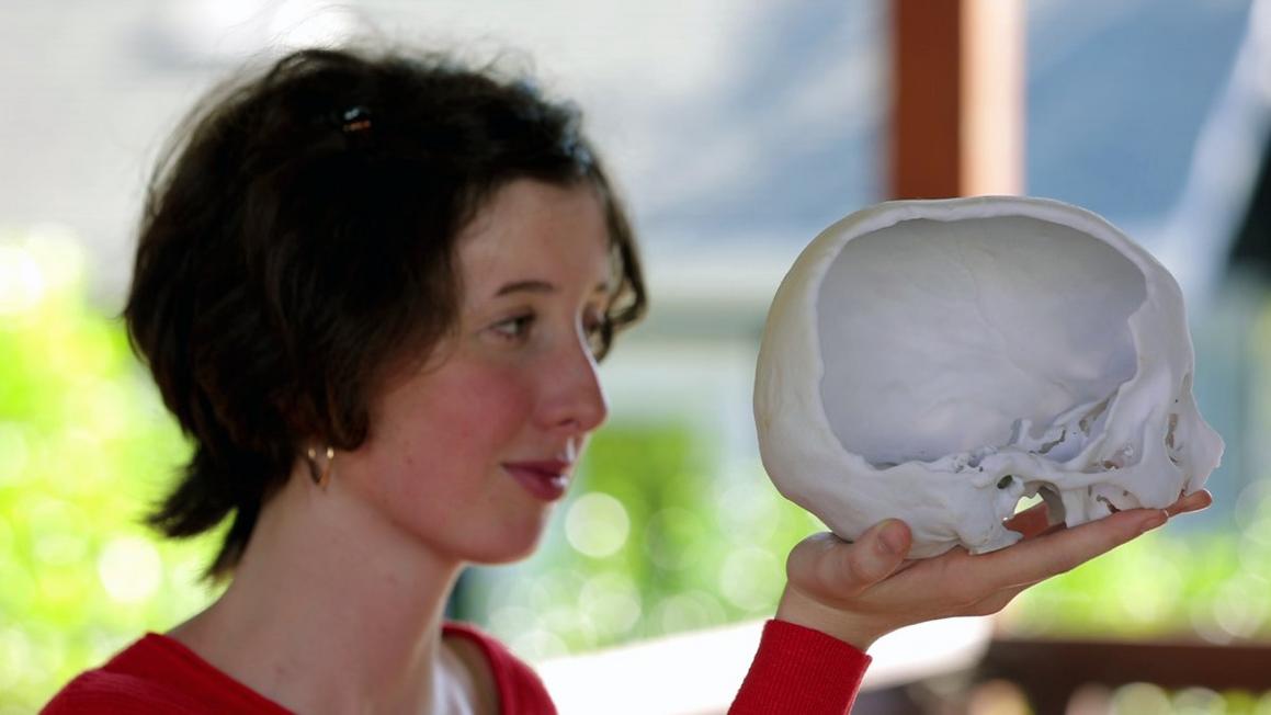 Amelia holding replica skull color corrected