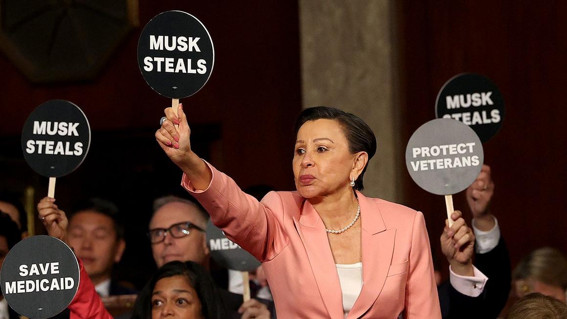 nydia velazquez holding sign 2025