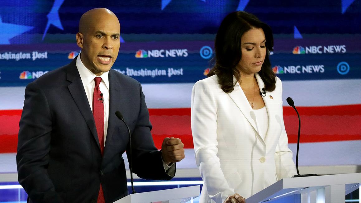 cory booker and tulsi gabbard onstage