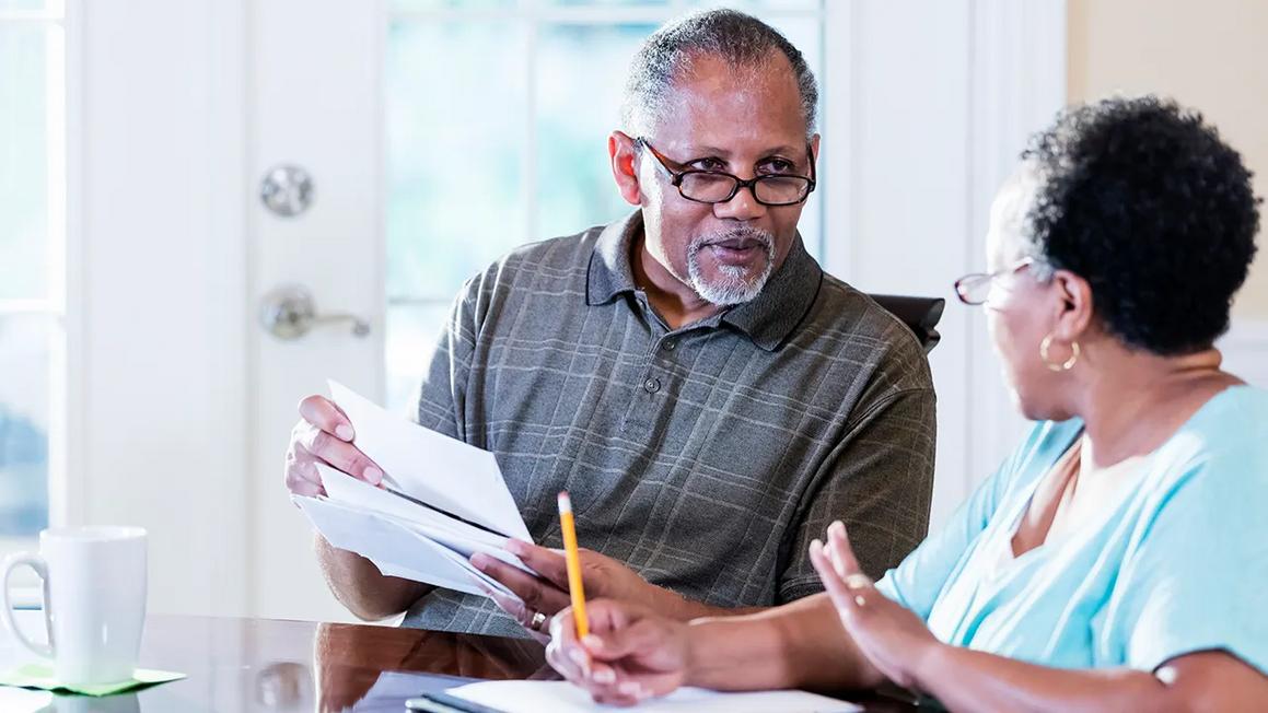couple looks at bills