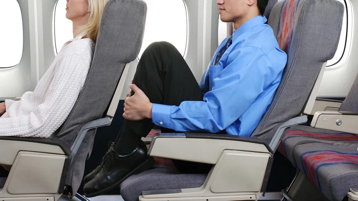 mans feet airplane seat