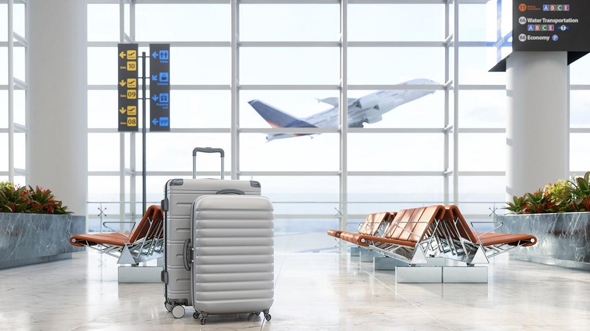 Rủi ro bảo mật dữ liệu và cách tự bảo vệ khi du lịch mùa lễ hội 1 suitcases airport plane taking off