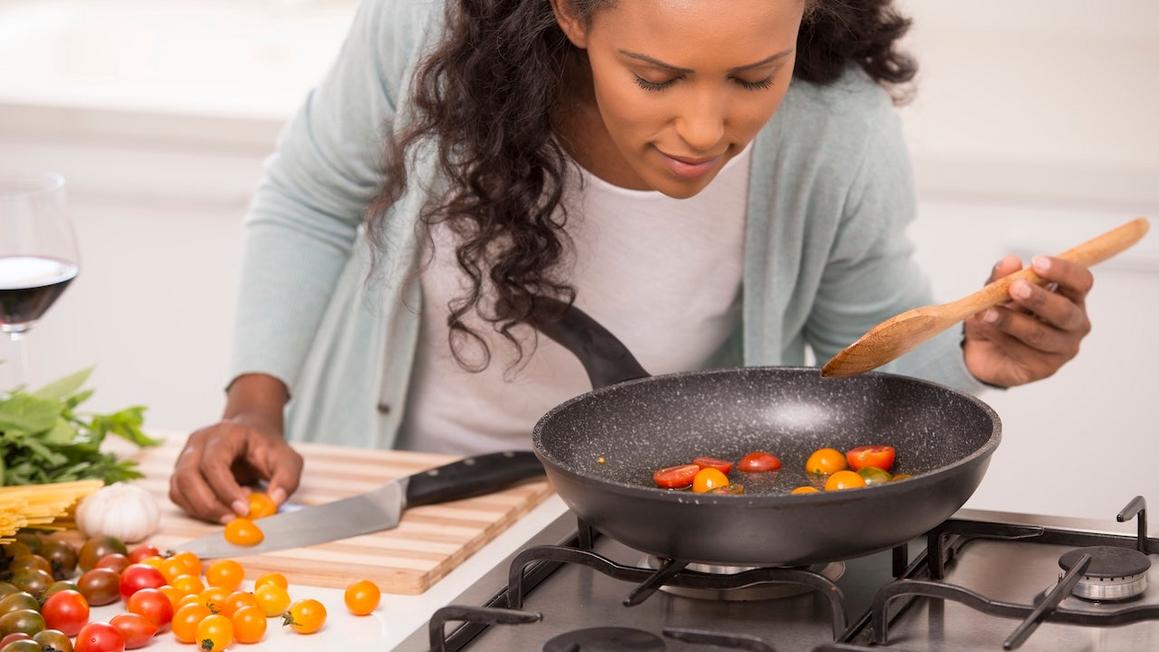 woman cooking nonstick skillet
