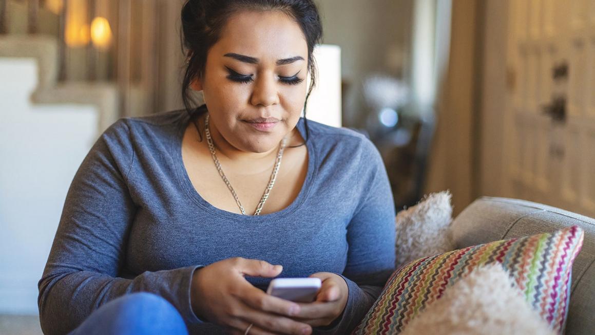 woman texting on smartphone