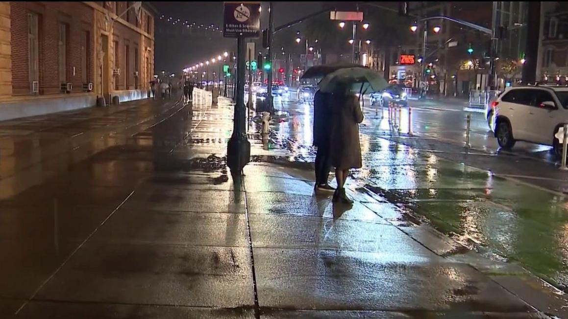Crowd in San Francisco gathers for fireworks show despite rain