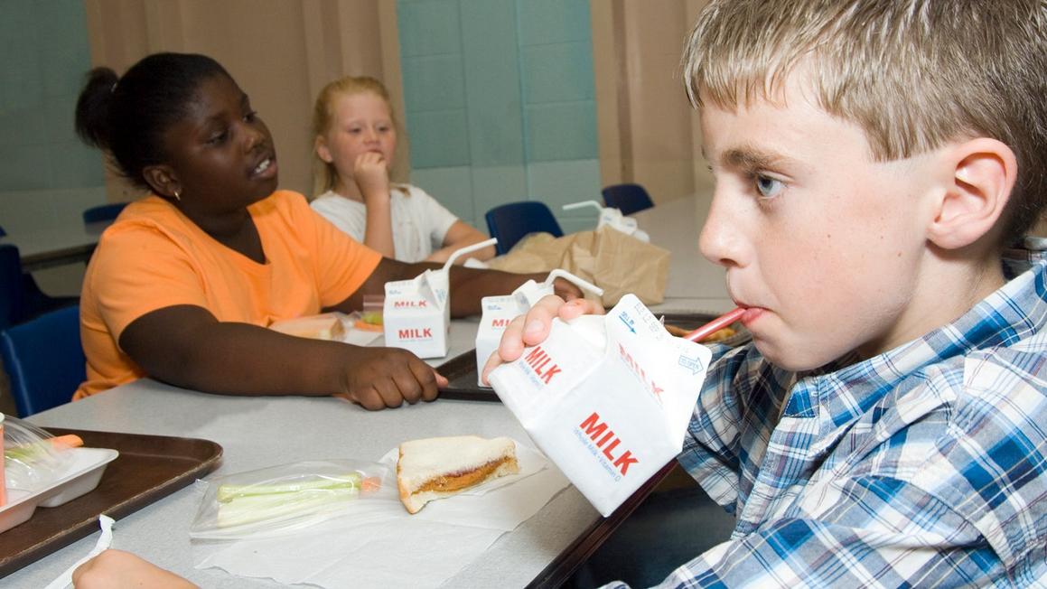 kid drinking milk at school