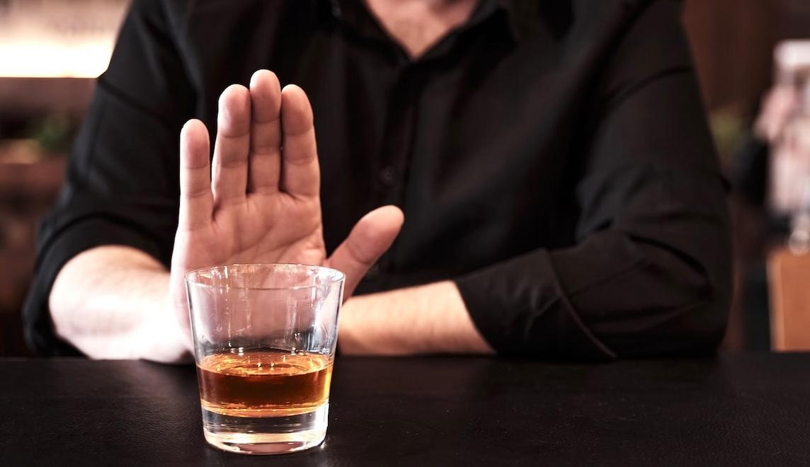 man abstaining from drinking