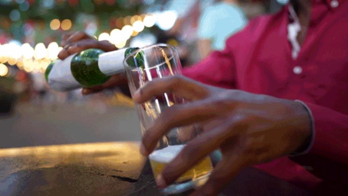 man pouring beer alcohol tips 1