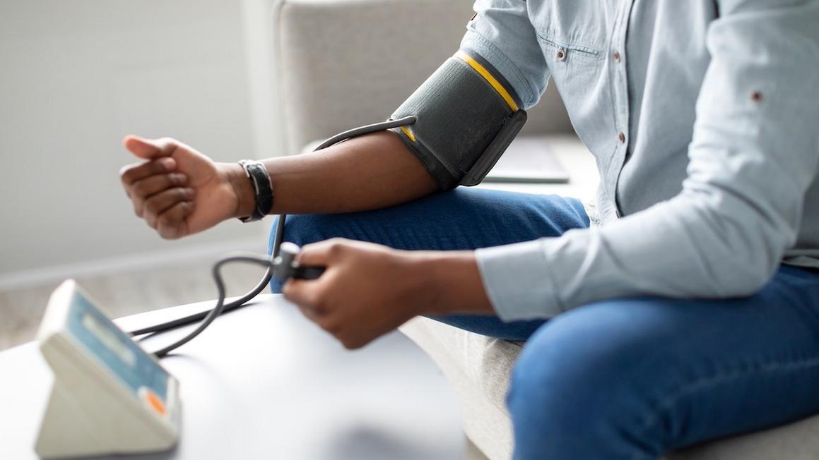 man taking blood pressure