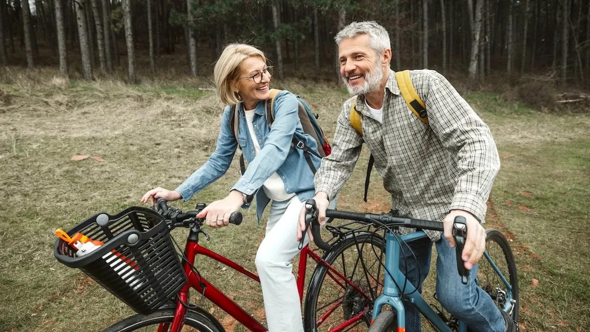 mature couple riding bikes 1