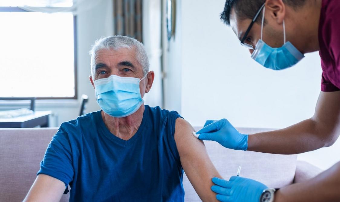 older man getting vaccine