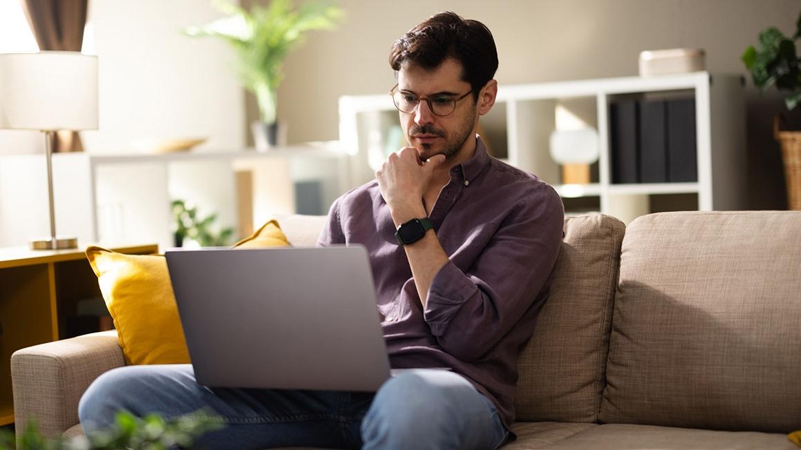 serious man on laptop computer