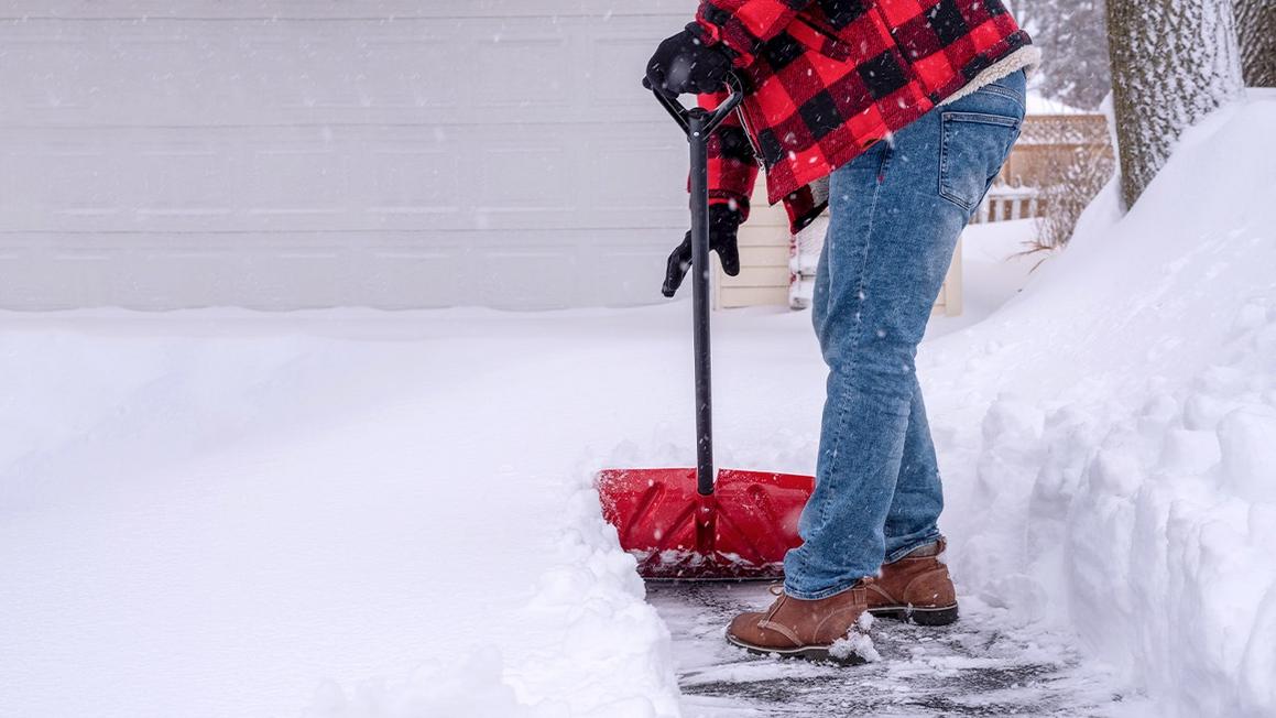 shoveling snow driveway man 1