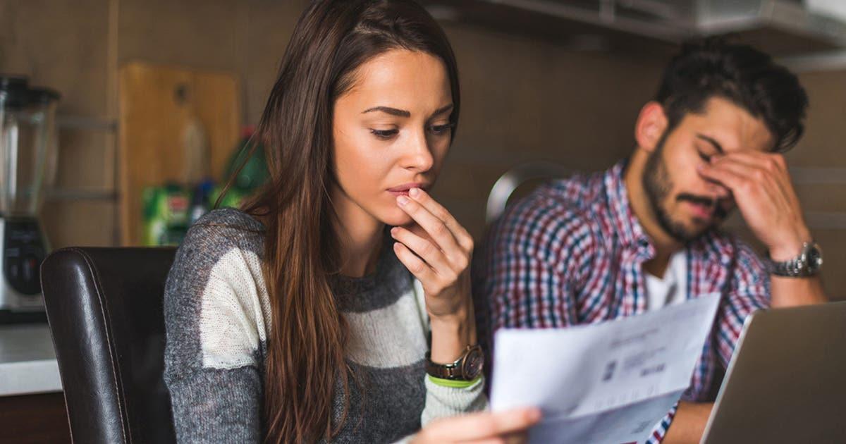 stressed couple doing bills scaled 1